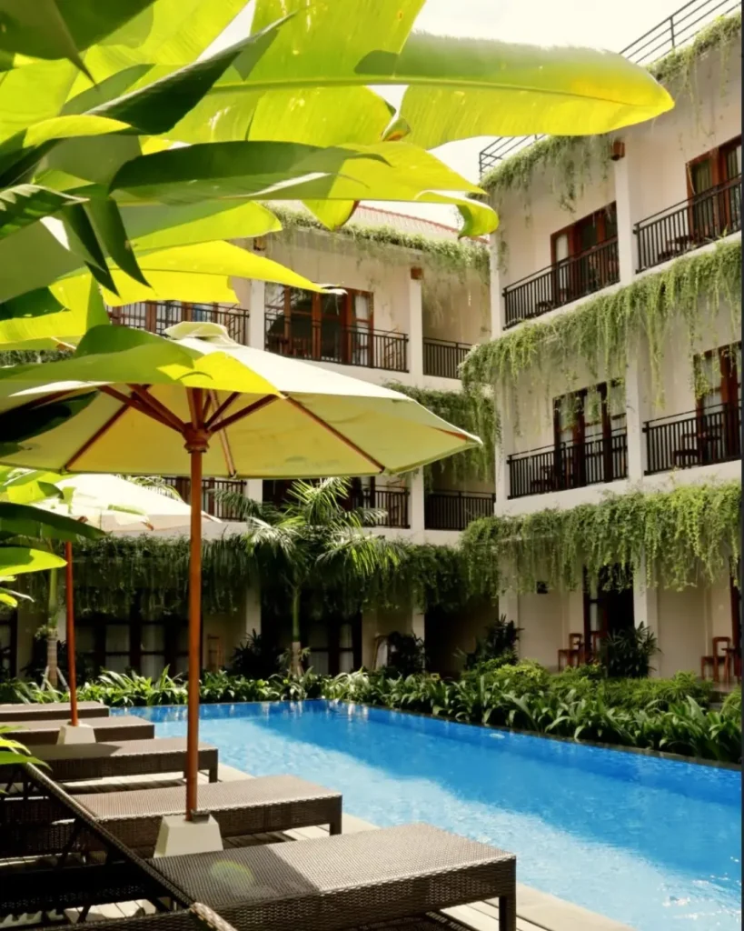 Pool and sun loungers below the balconies