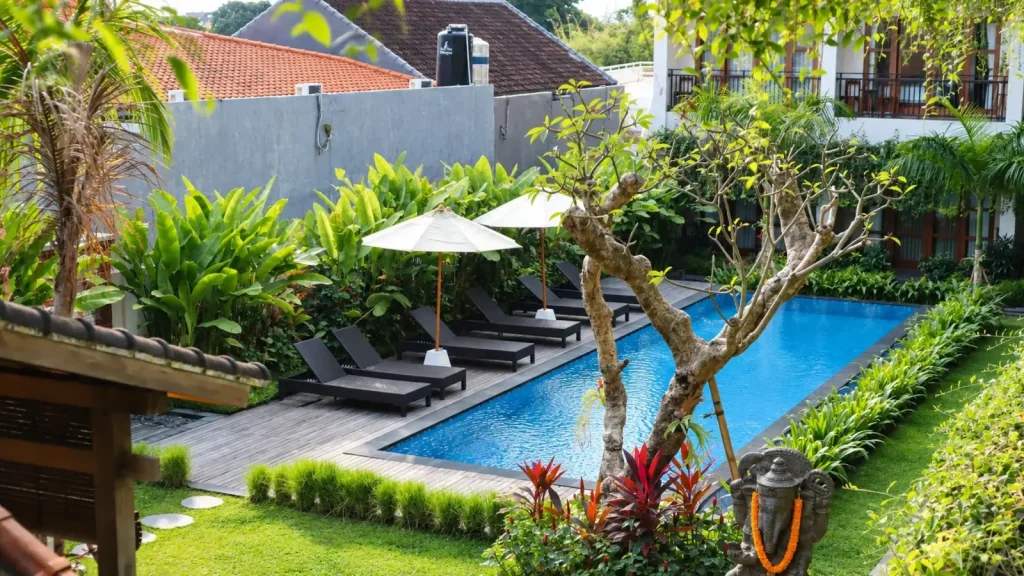 The pool and garden at Puri Kaja House