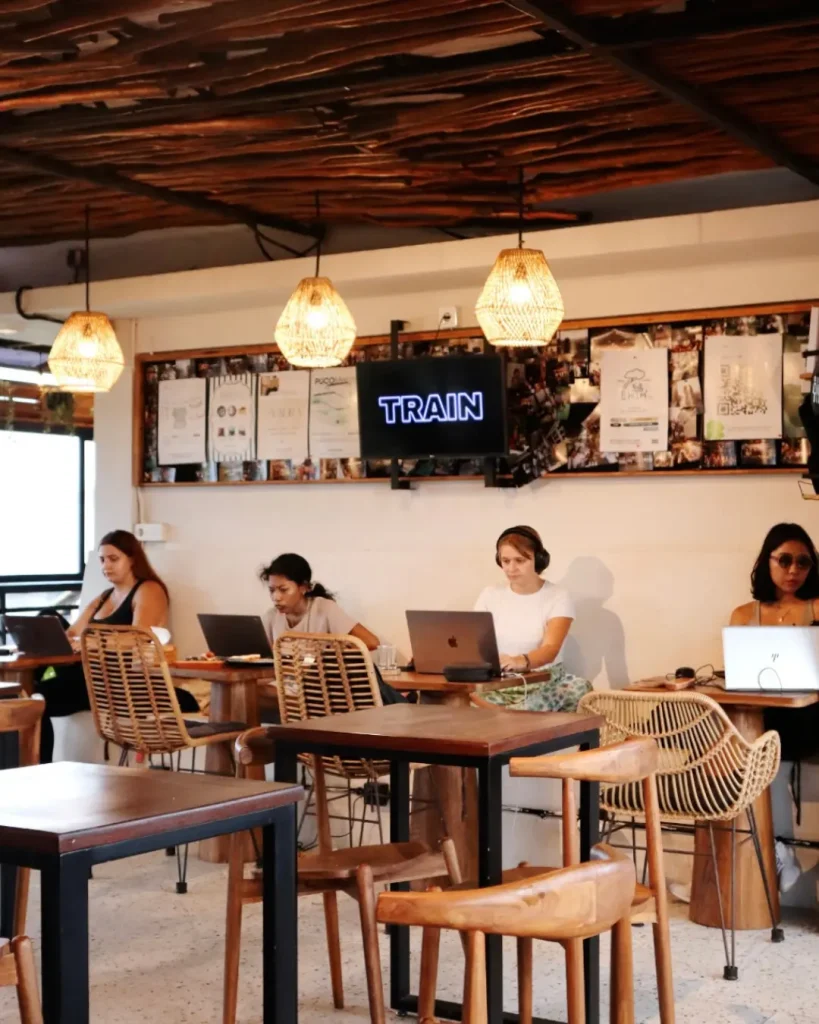 Guests working on laptops in the Eatery