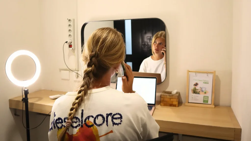 A member on a call in the Focus Room+, with its mirror and ring light