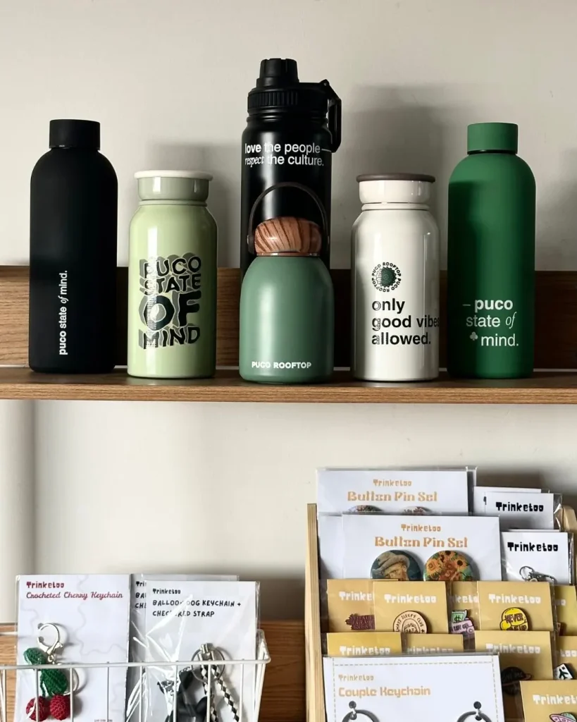 PUCO tumblers and bottles on the merch shelf