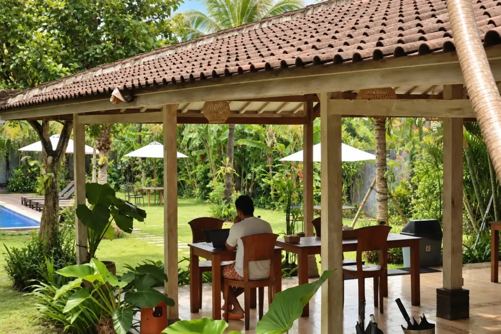 Working on a laptop under the gazebo