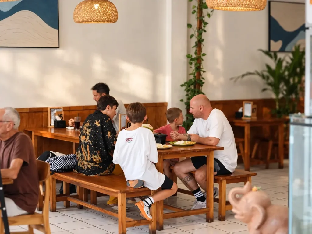 A family sharing a meal at Warung Dangin